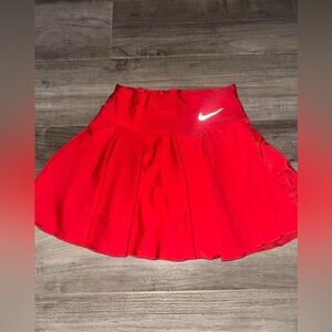 Red Nike pleated tennis skirt with built in undershorts